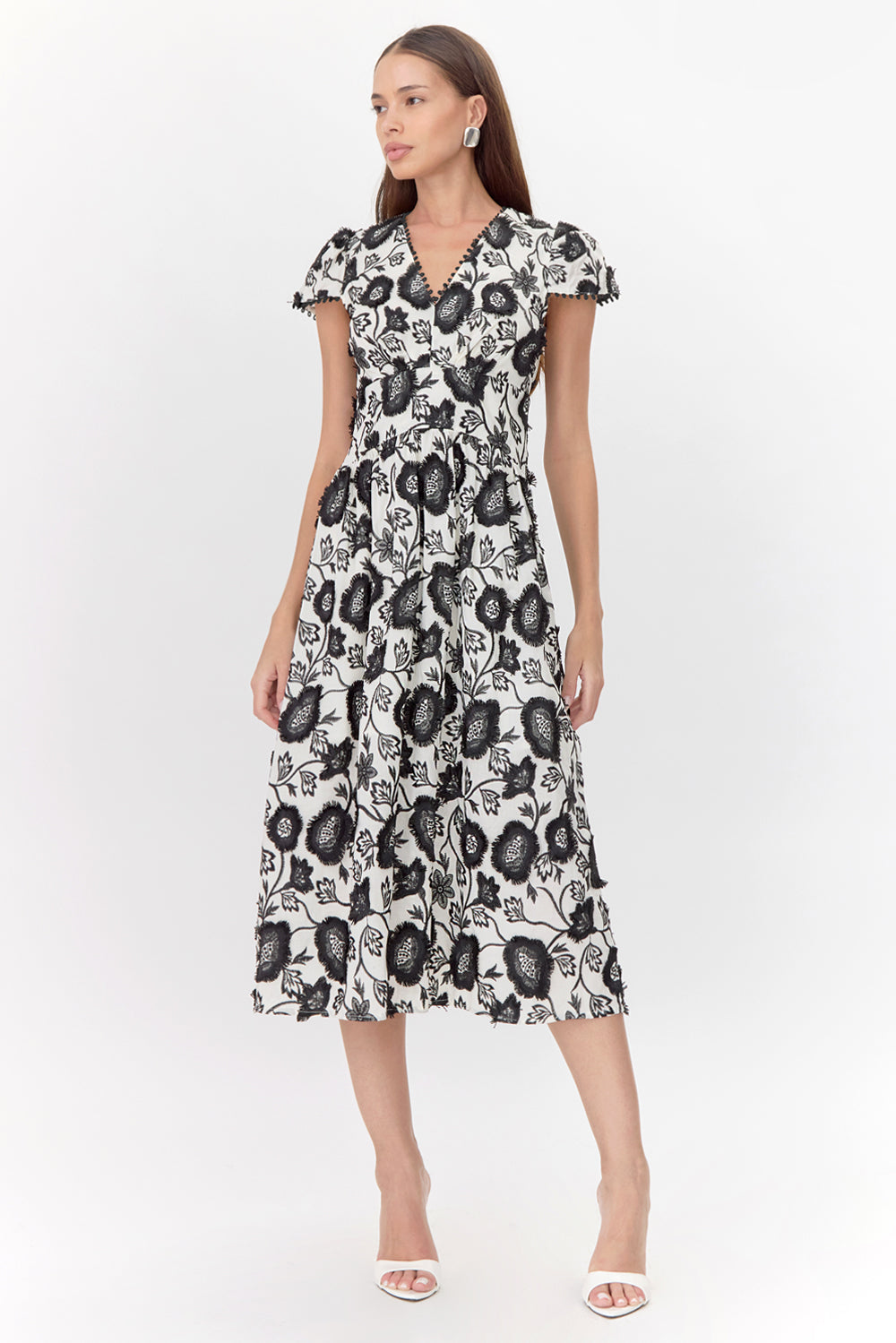 Embroidered v-neck midi wedding guest dress and graduation dress front studio view looking to the side