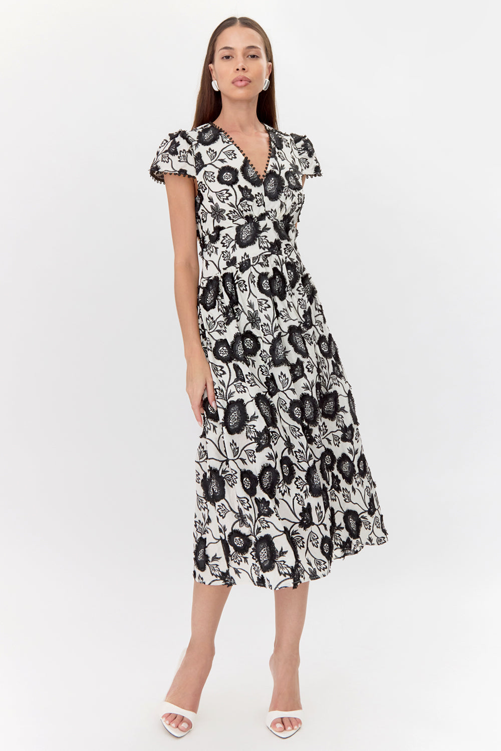 Embroidered v-neck midi wedding guest dress and graduation dress front studio view looking ahead