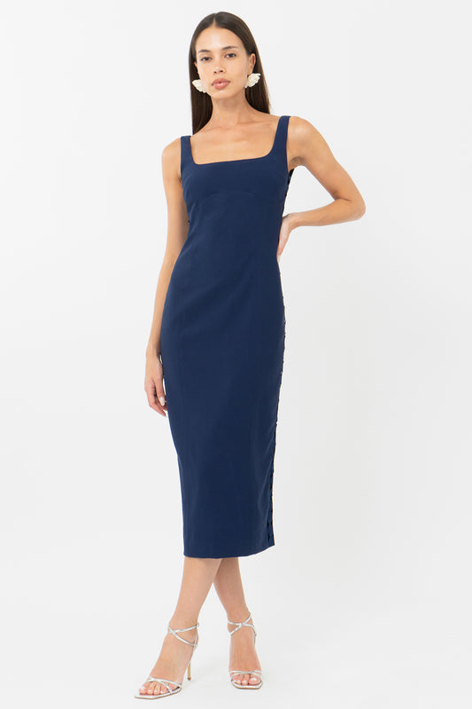 Navy blue bodycon midi wedding guest dress and graduation dress front studio view hand on hip