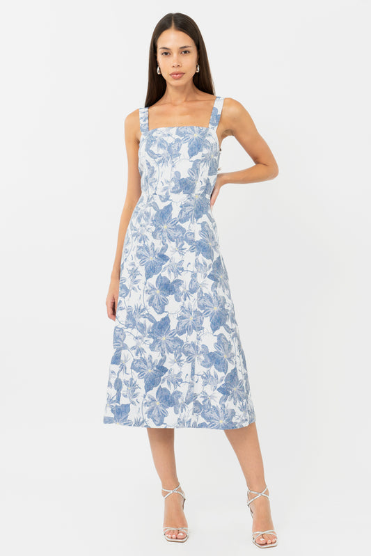 Blue and white floral wedding guest dress and graduation dress front studio view with hand on hip