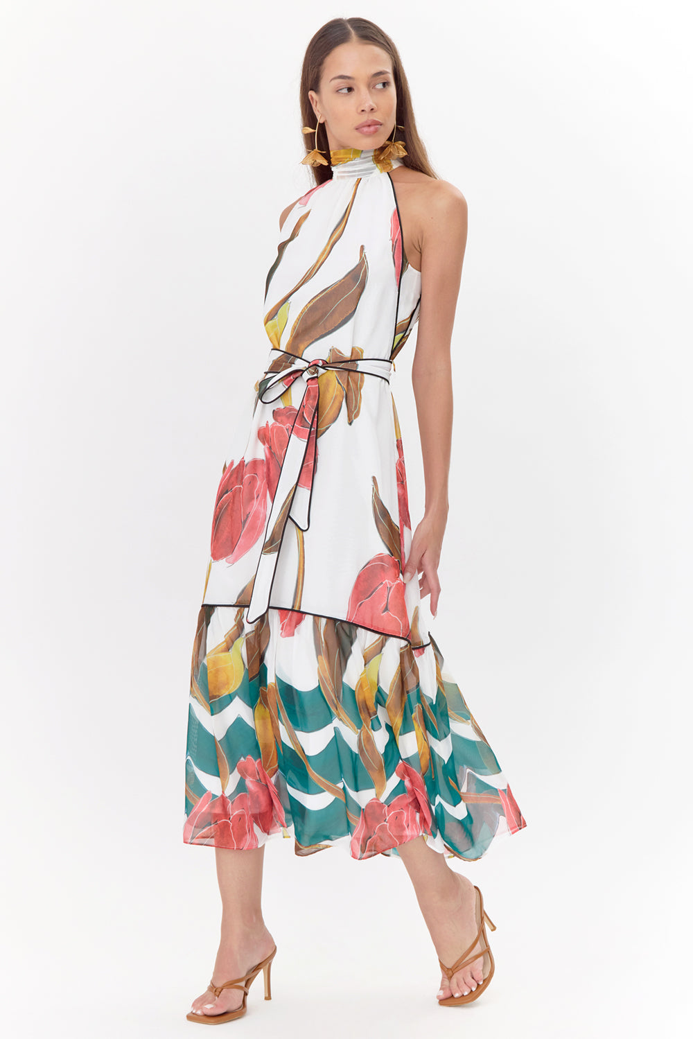 Printed tiered wedding guest dress and graduation dress front studio view looking to the side 