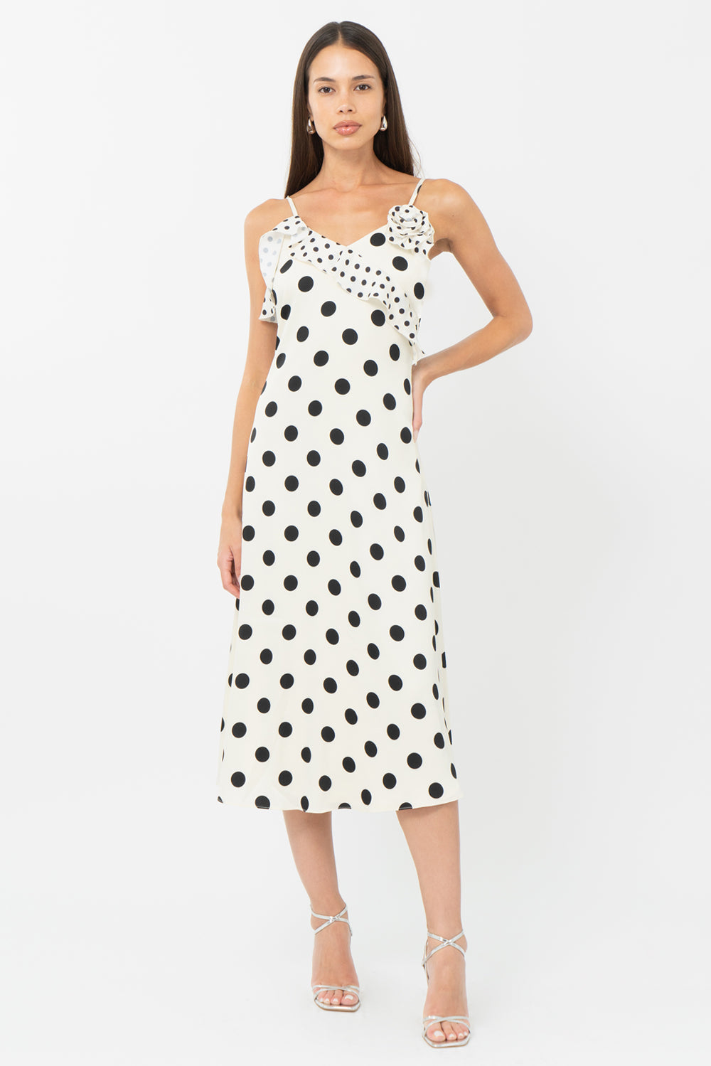 black and cream Polka dot wedding guest dress and graduation dress with ruffles front studio view